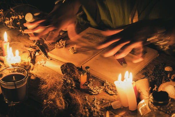 istockphoto-1193478029-612x612 Hands fortune teller over an ancient table with herbs and books. Manifestation of occultism in the form of divination.